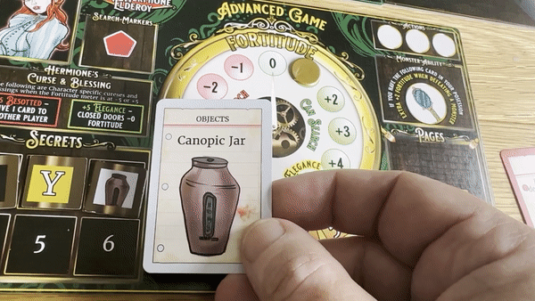 A player collecting a page card in Horror in the Library
