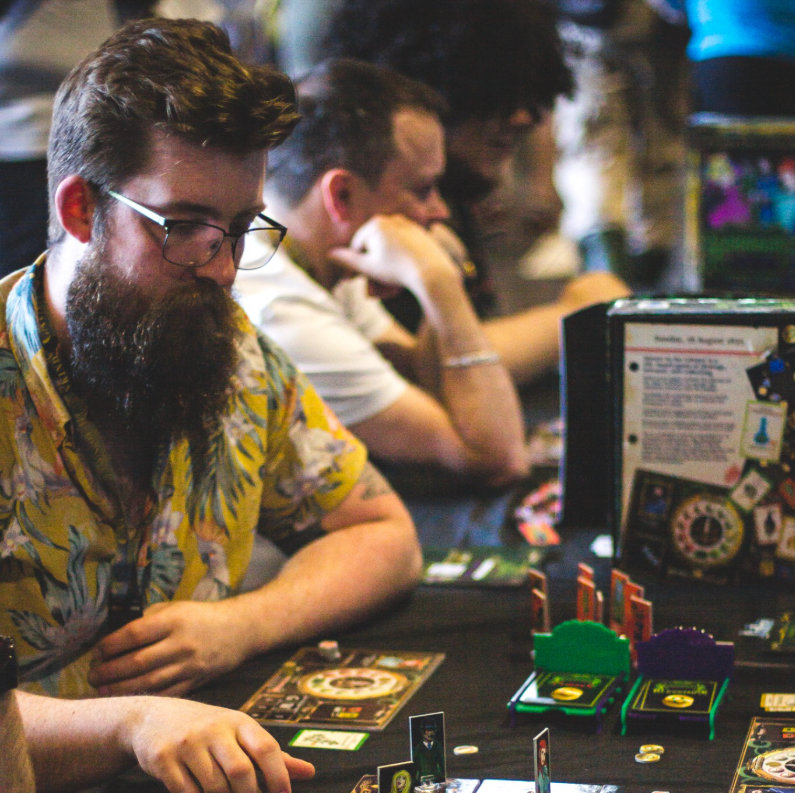 Players around the table creating social tension and betrayal