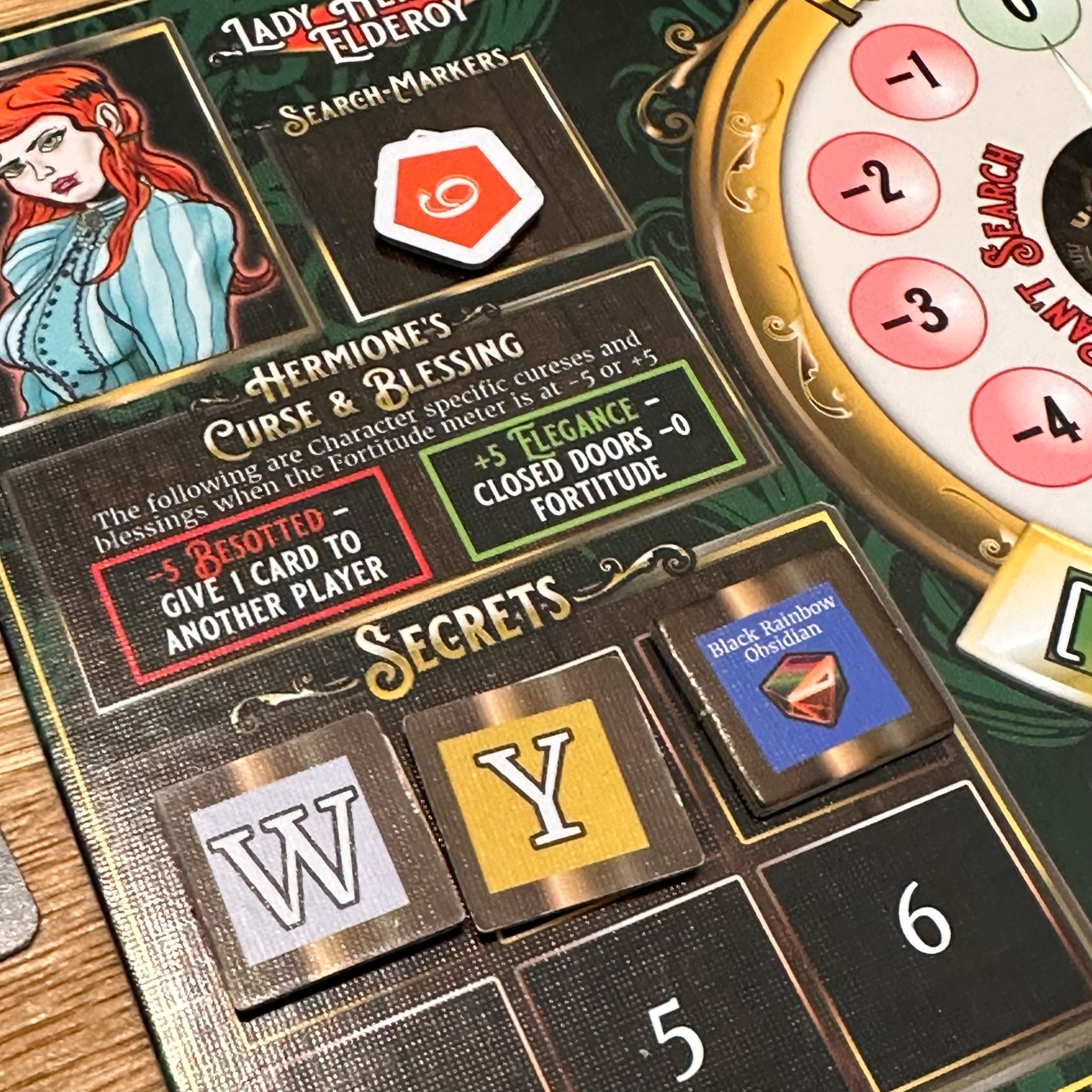 Close-up of Horror in the Library secrets, blessings and player board
